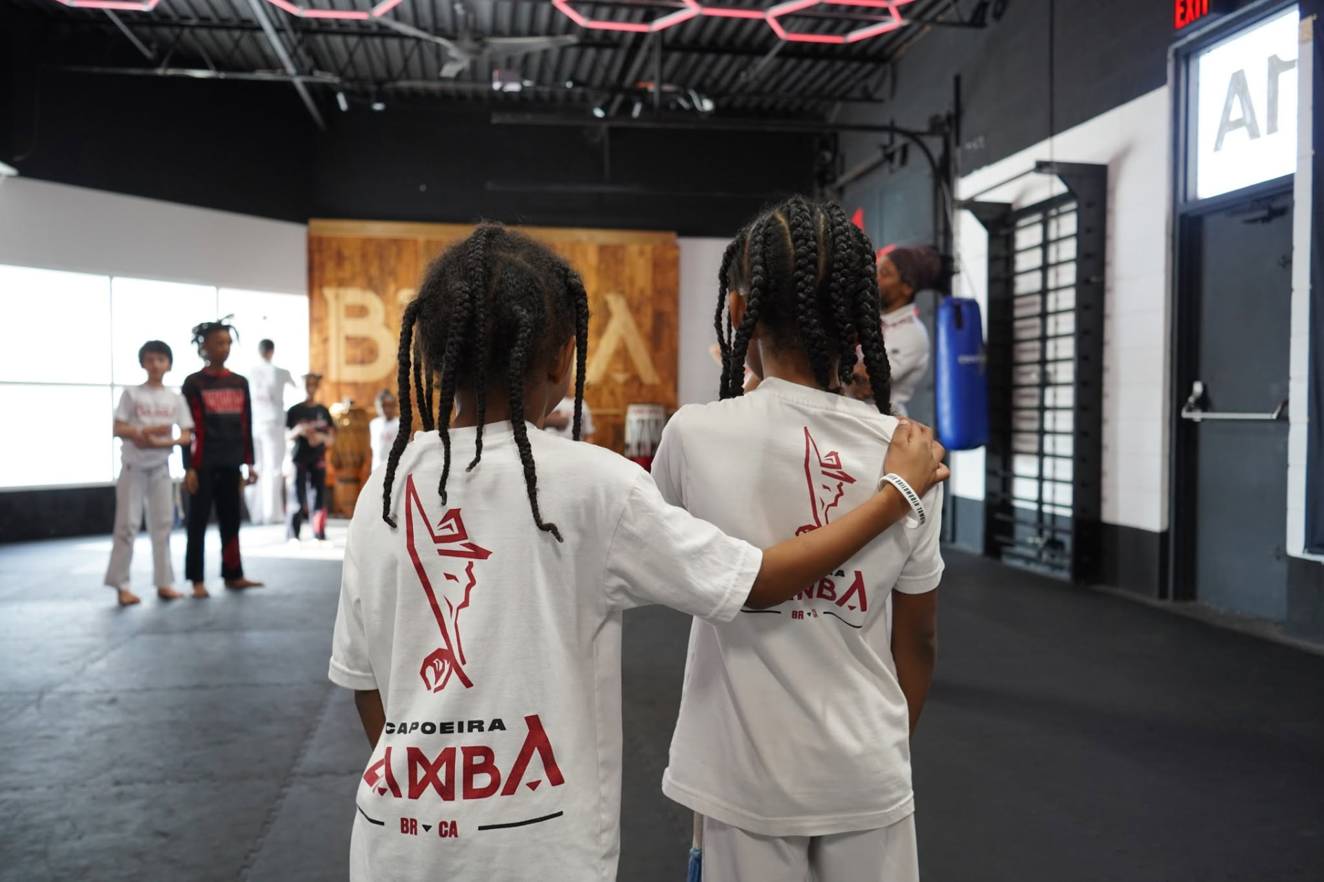 Young students in capoeira uniforms watching class at Z GRVTY